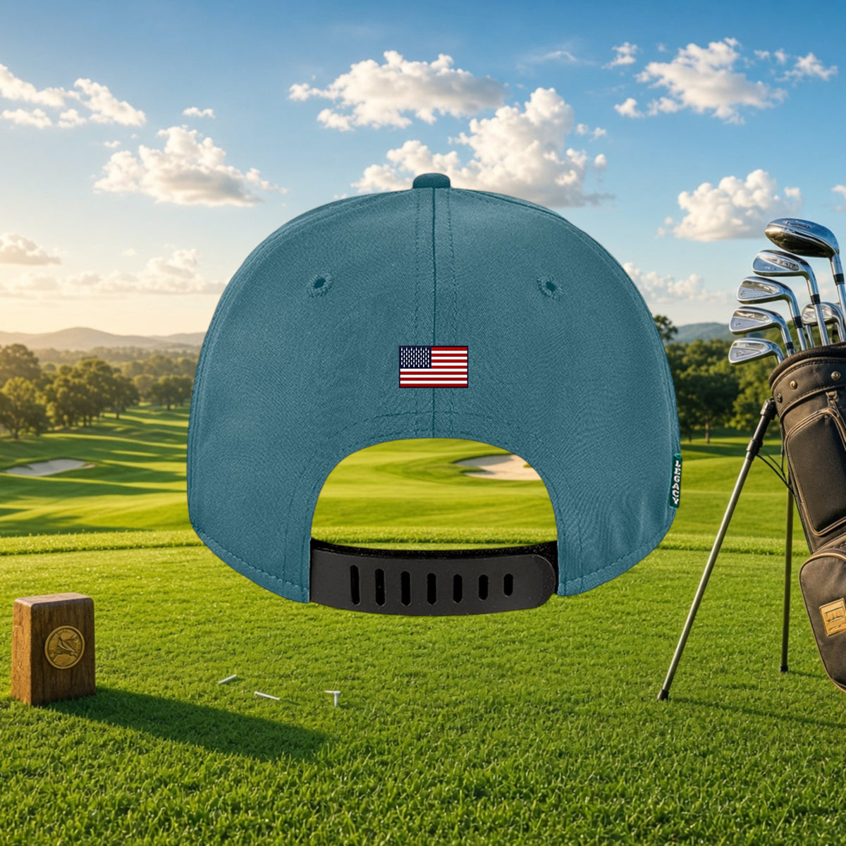 Better Grab A Beer blue six-panel golf cap with US flag patch and rubber strap closure on a golf course background