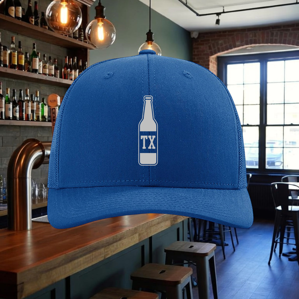 Better Grab A Beer blue six-panel trucker hat with a white TX beer bottle graphic and adjustable snapback closure.