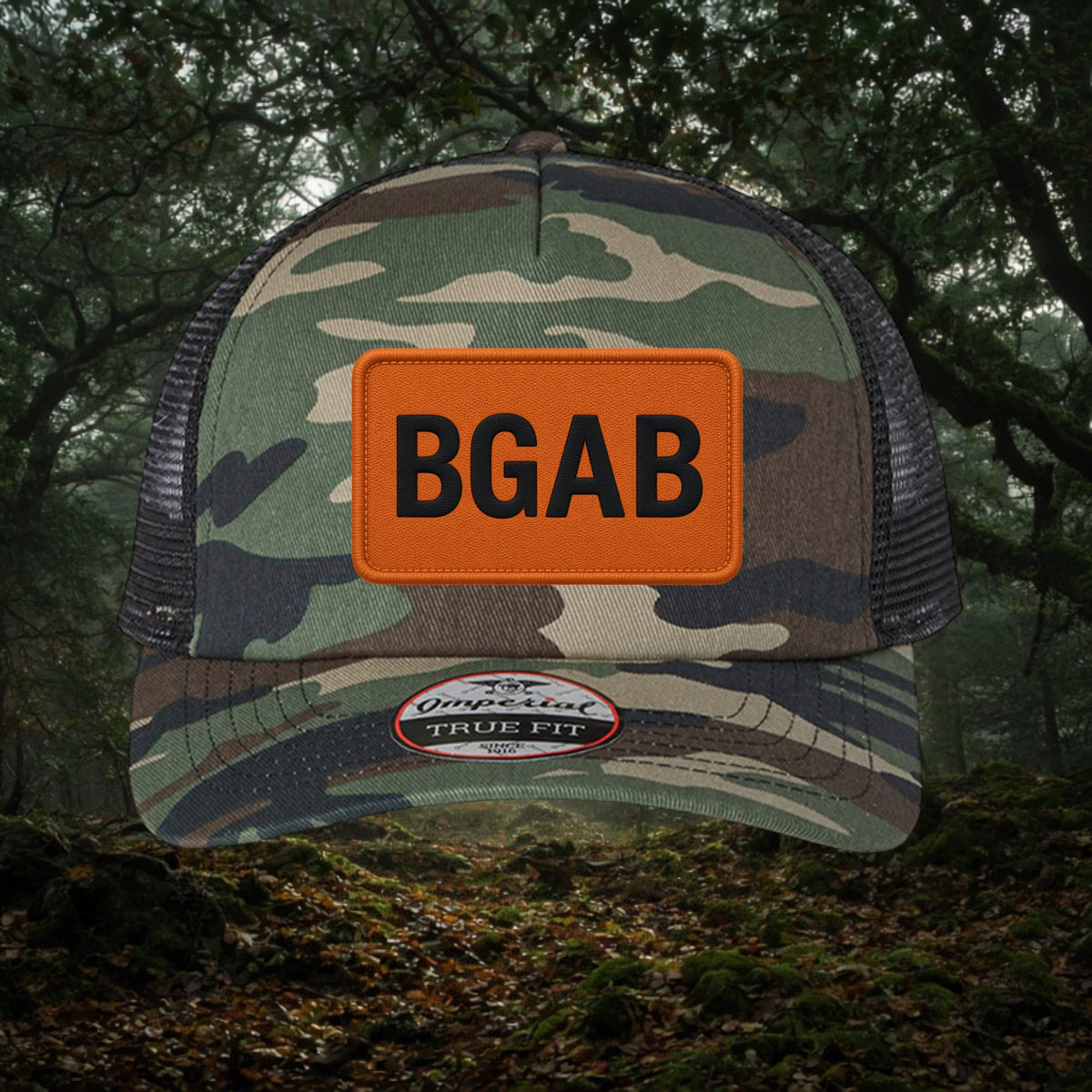 Better Grab A Beer camo trucker hat with orange patch and black BGAB logo, featuring mesh back and structured fit.