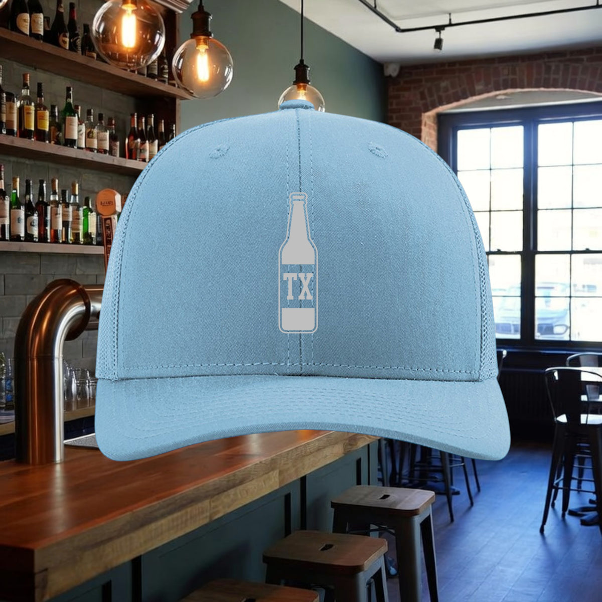 Better Grab A Beer light blue structured trucker hat with a white TX bottle graphic and adjustable snapback closure.