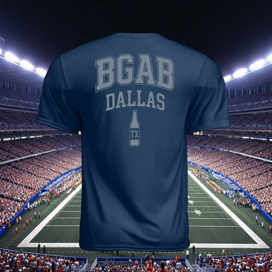 Better Grab A Beer navy blue performance t-shirt with BGAB Dallas beer bottle graphic, back view in stadium setting.