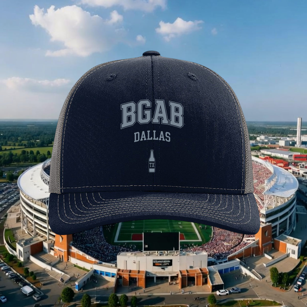 Better Grab A Beer navy blue six-panel trucker hat with BGAB Dallas logo and mesh back against a stadium background