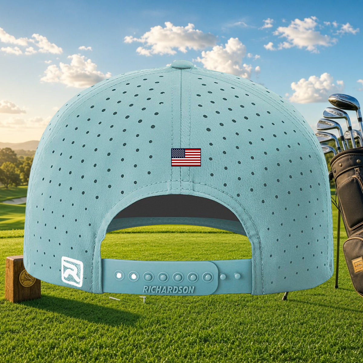 Better Grab A Beer light blue perforated golf cap with US flag detail and snapback closure on a golf course background