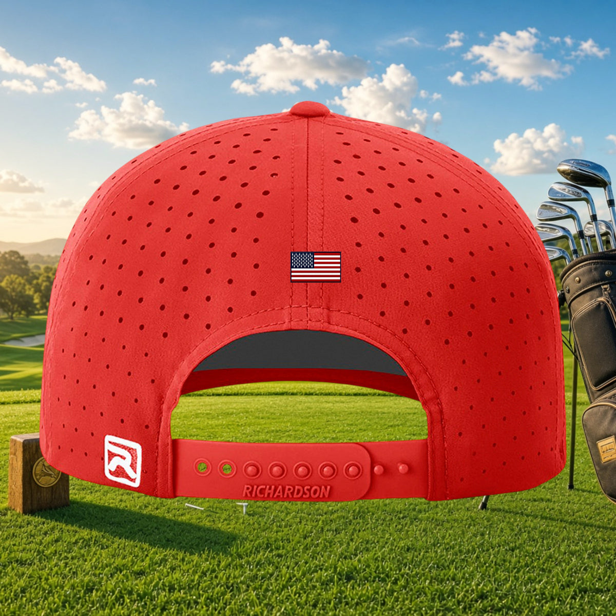 Better Grab A Beer red golf cap with laser-cut perforations, US flag detail, and snapback closure on a golf course.