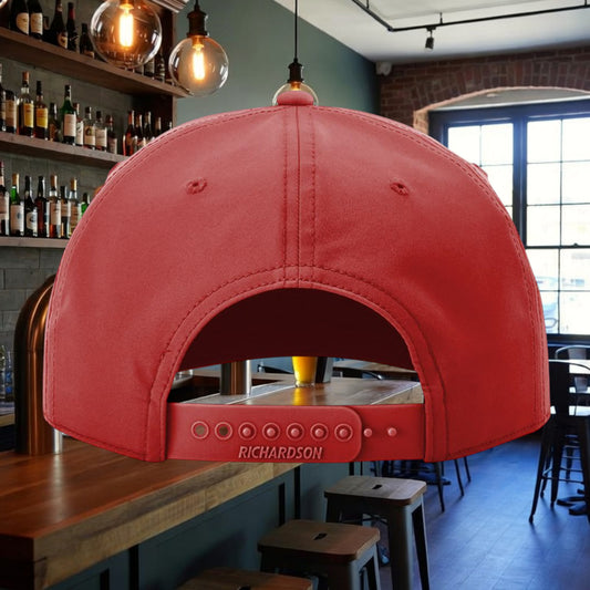 Better Grab A Beer red five-panel performance rope hat with adjustable snapback closure in a bar setting