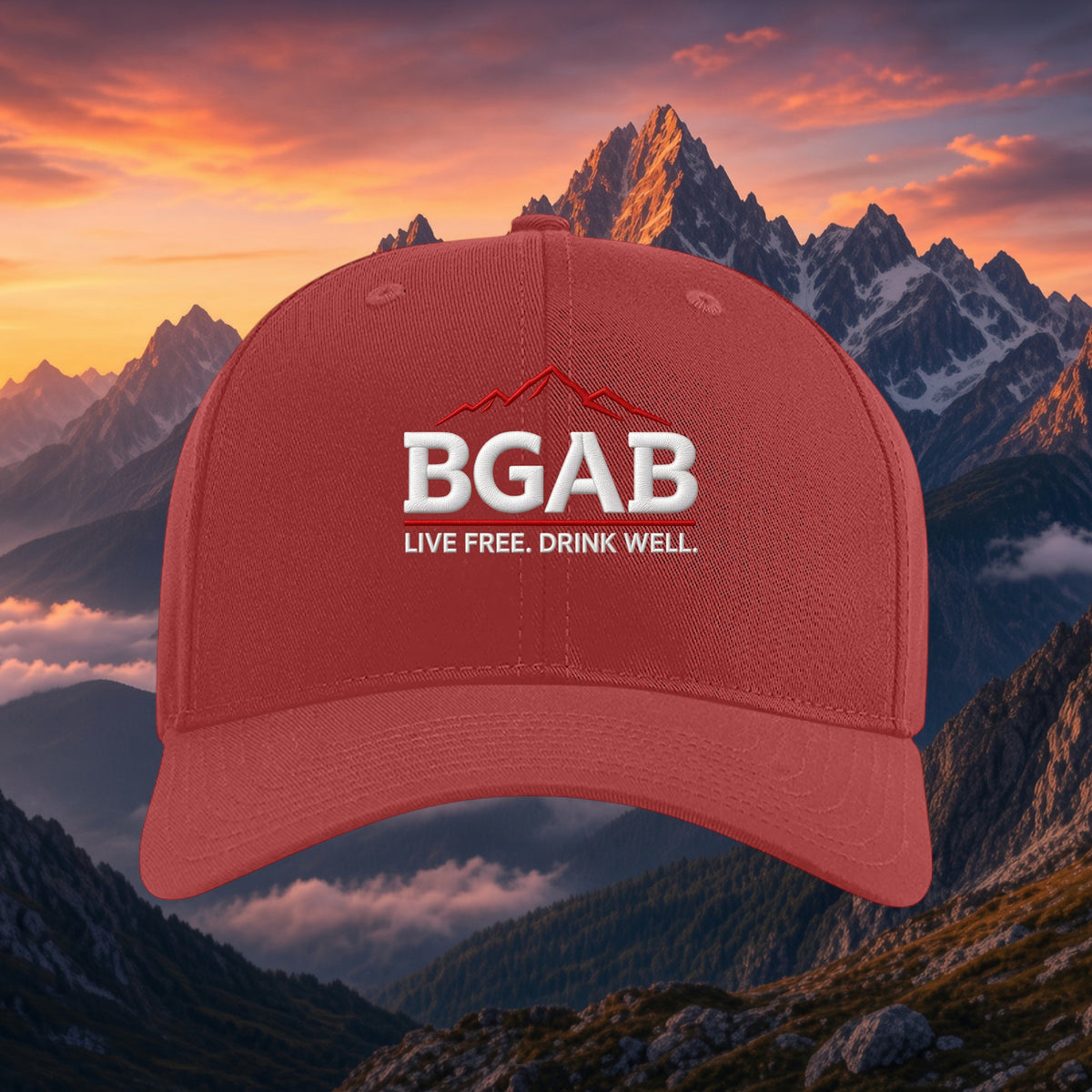 Better Grab A Beer red six-panel twill snapback cap with white BGAB mountain logo against a sunset mountain backdrop