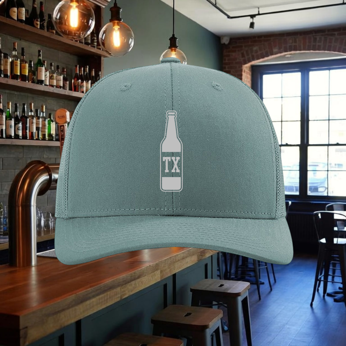Better Grab A Beer TX Bottle trucker hat in sage green with a white beer bottle graphic and adjustable snapback.