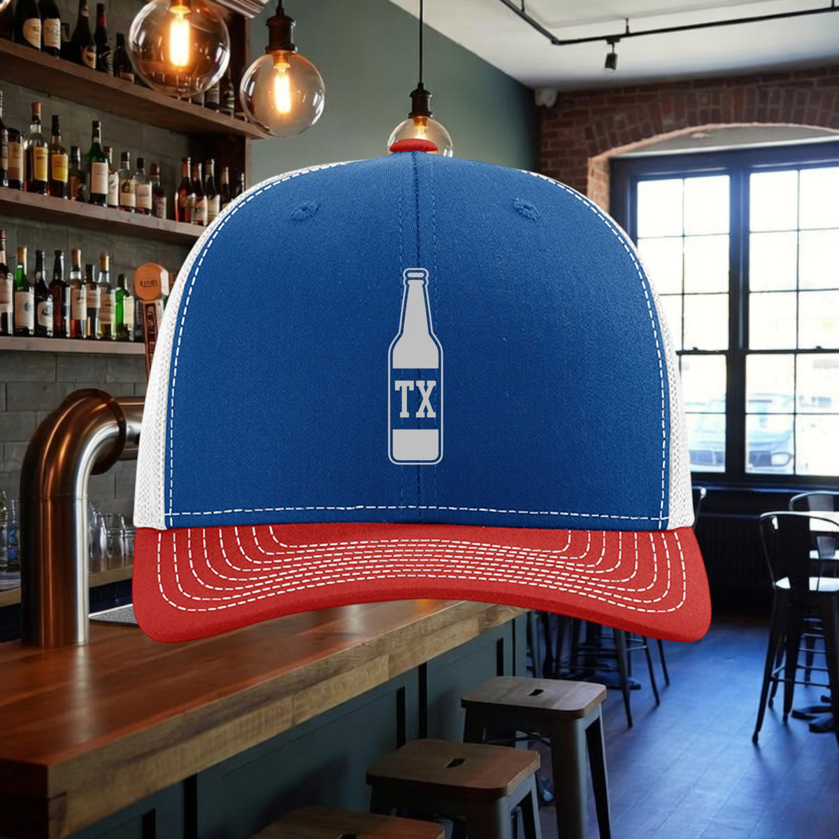 Better Grab A Beer TX Bottle trucker hat with blue front, white mesh back, and red pre-curved contrast stitched visor.