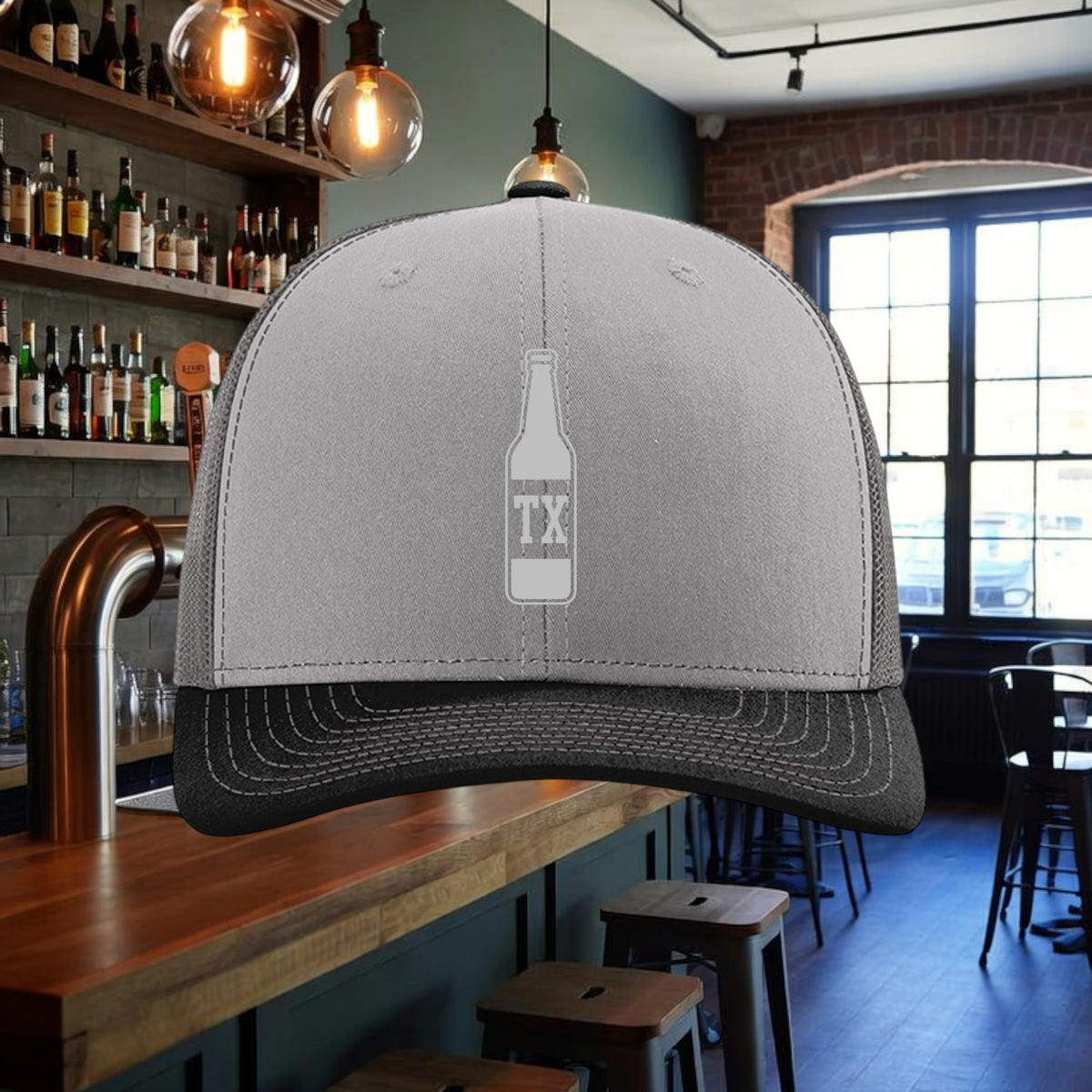 Better Grab A Beer TX Bottle trucker hat in grey with a black mesh back and pre-curved contrast stitched visor.