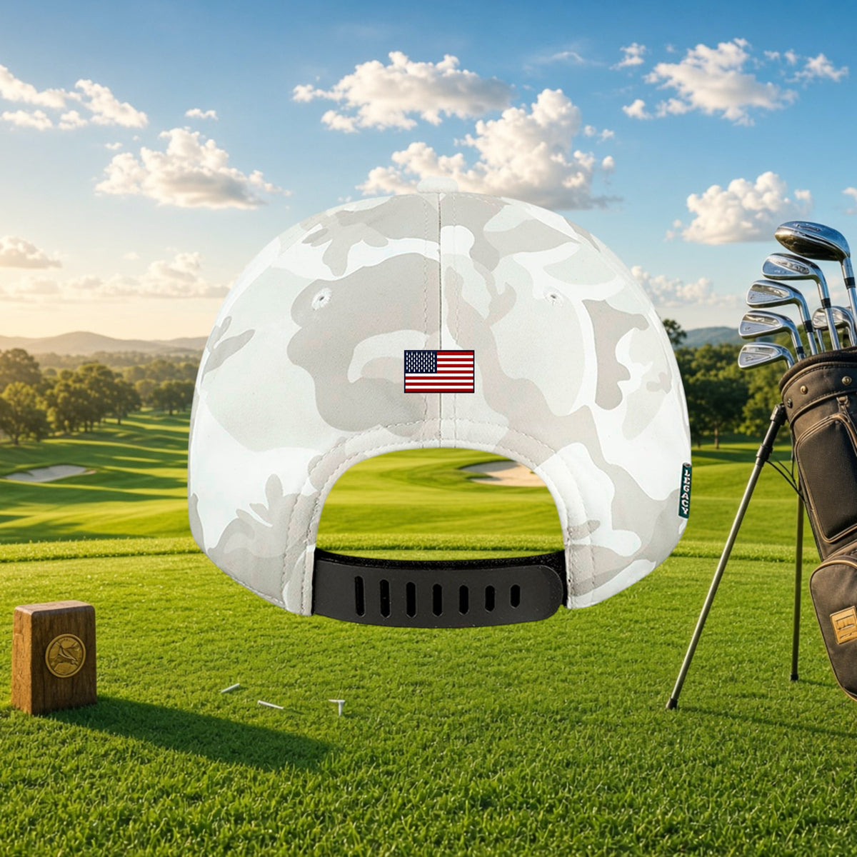 Better Grab A Beer white camo golf cap with US flag detail and rubber strap closure on a sunny golf course background